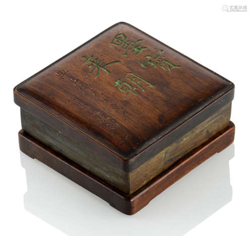 A DUAN INKSTONE WITH HARDWOOD STAND AND INSCRIBED COVER