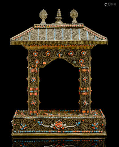 A BRASS MOUNTED GATE DECORATED WITH TURQUOISE AND CORAL STONES