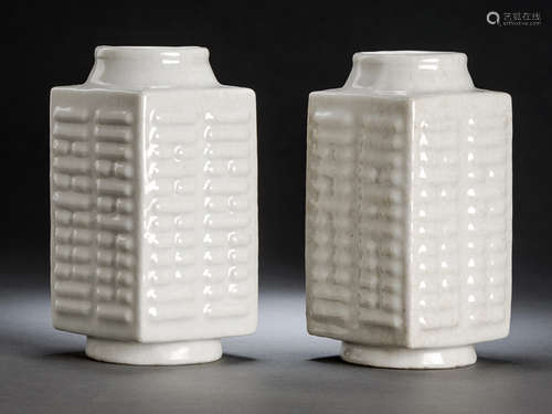 A PAIR OF CREAM-GLAZED CONG-SHAPED BAGUA PORCELAIN VASES