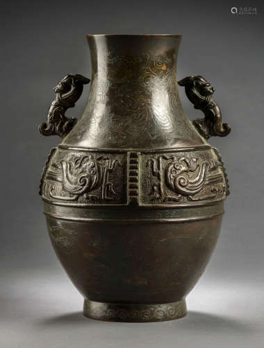 A HU-SHAPED BRONZE VASE WITH SILVER-INLAID DRAGON DECOR