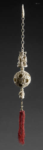 A FINE CARVED IVORY PUZZLE BALL WITH FIGURAL PENDANT AND IVORY CHAIN