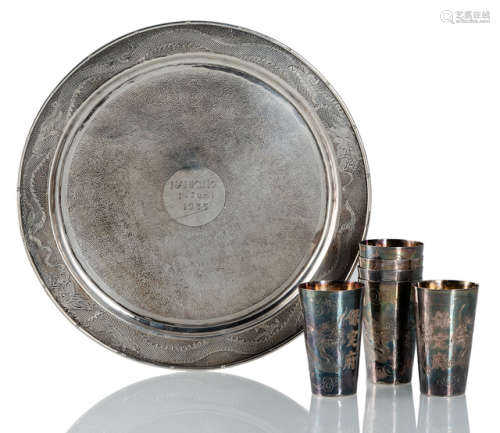 A SILVER PLATE WITH DRAGON DECORATION AND DEDICATION 'NANKING 1.Juni 1935' AND S SET OF SIX SILVER CUPS