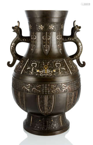 A VERY LARGE SILVER- AND GOLD-INLAID BRONZE VASE IN ARCHAIC STLYE