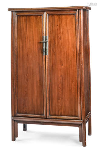 A TAPERED HARDWOOD CABINET