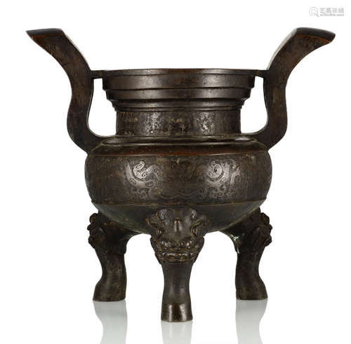 A LARGE BRONZE TRIPOD CENSER