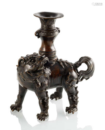 A BRONZE LION WITH VASE FOR AN ALTAR