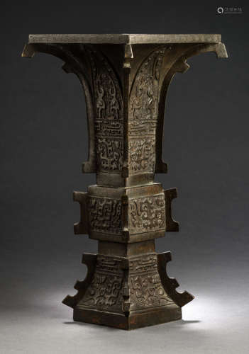 A GU-SHAPED BRONZE VASE DECORATED IN AN ARCHAIC STYLE