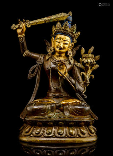 A BRONZE FIGURE OF MANJUSHRI