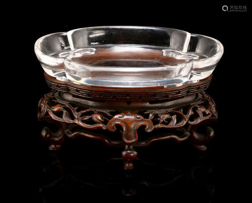 A FINELY CARVED CRYSTAL BRUSHWASHER ON A CARVED WOOD STAND