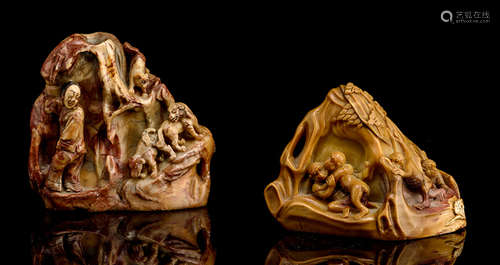 TWO CARVED SOAPSTONE PAPERWEIGHTS SHOWING MONKEYS AND DOGS