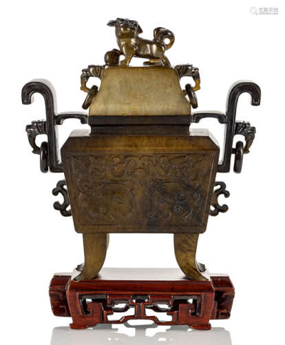 A STONE CENSER WITH COVER ON A WOOD STAND