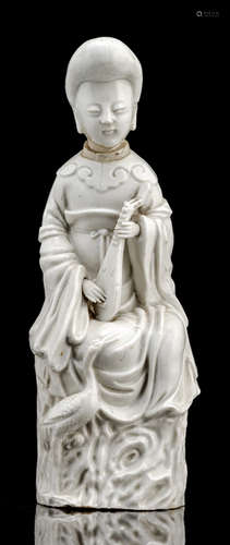 A DEHUA FIGURE OF GUANYIN PLAYING THE PIPA