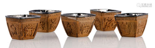 A SET OF FIVE CARVED FOUR-SIDED WINE CUPS