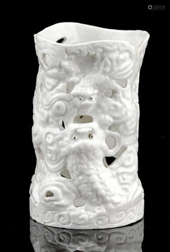 A WHITE-GLAZED BISCUIT PORCELAIN BRUSHPOT WITH RETICULATED LIONS AND LINGZHI