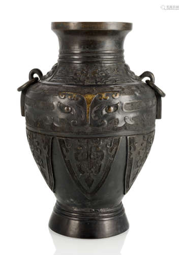 A PART-GILT HU-SHAPED BRONZE VASE IN ARCHAIC STYLE