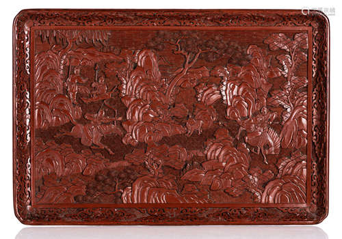 A CARVED CINNABAR LACQUER TRAY DEPICTING A HUNTING SCENE