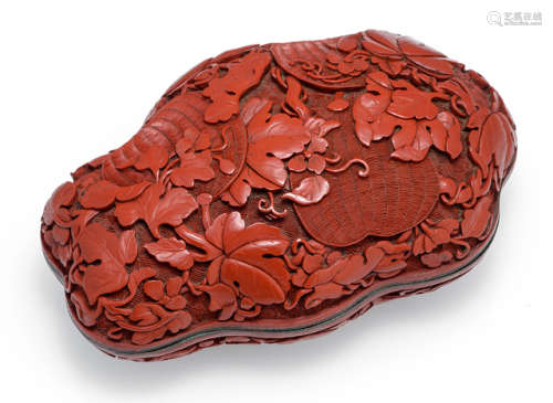 A FINE CARVED CINNABAR LACQUER BOX AND COVER WITH FRUITS AND LEAVES