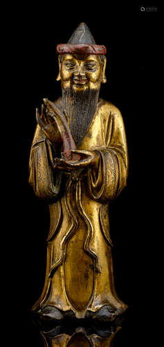 A GILT-BRONZE FIGURE OF A FOREIGNER