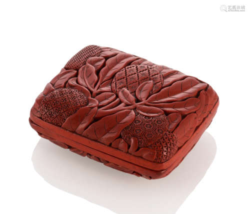 A CARVED CINNABAR LACQUER 'LYCHEE' BOX AND COVER