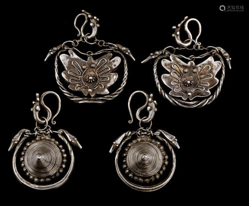 TWO PAIRS OF PENDANTS IN CIRCULAR SHAPE WITH HOOKED-ON SPIRALS AND ZOOMORPHIC ELEMENTS