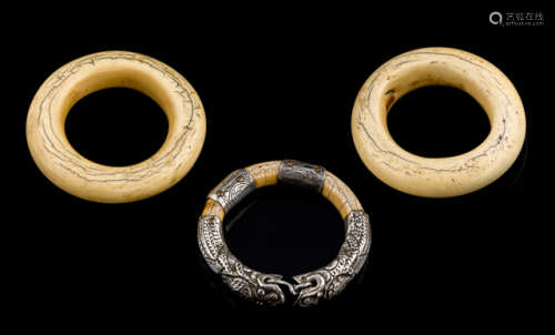A GROUP OF THREE IVORY BANGLES