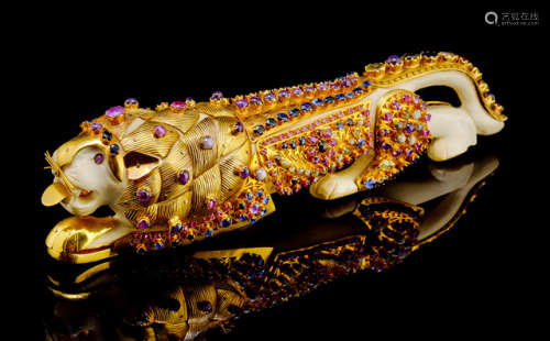 A CARVED IVORY TIGER WITH GOLD AND SILVER DECORATION AND VARIOUS INLAID JEWELERY