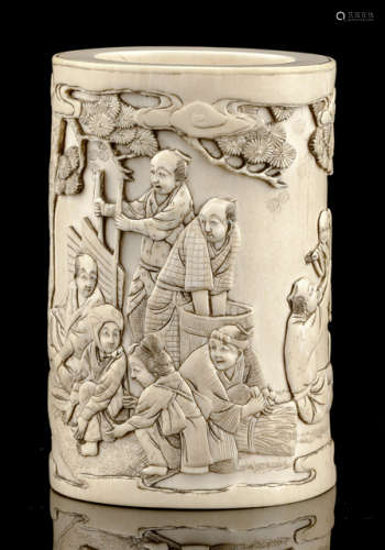 A CARVED FIGURAL IVORY BRUSHPOT