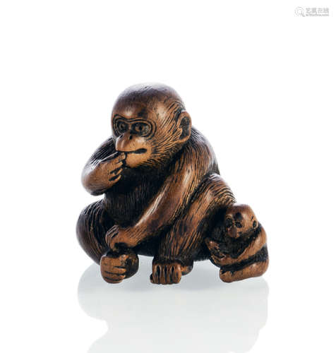 A WOOD NETSUKE OF A MONKEY WITH A YOUNG