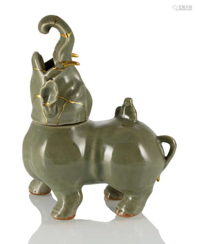 A CELADON-GLAZED CENSER IN SHAPE OF AN ELEPHANT AND BOY