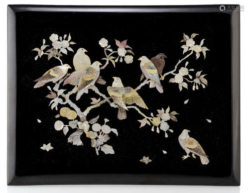 A DECORATIVE BLACK-LACQUERED WOOD PANEL