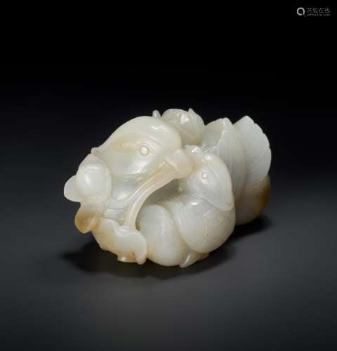 A QING DYNASTY CELADON AND RUSSET JADE ‘MANDARIN DUCKS AND LOTUS’ GROUP
