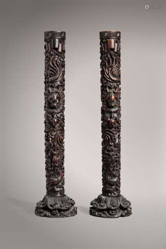 A PAIR OF ZITAN ‘TWO-DRAGON' CANDLESTICKS ON STANDS, QING DYNASTY