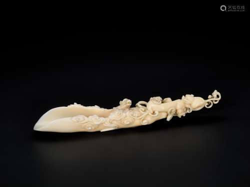 AN 18TH CENTURY IVORY RAFT-FORM POURING VESSEL WITH CHILONG