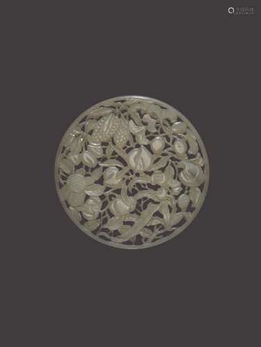 A RETICULATED CELADON JADE PLAQUE, QING DYNASTY