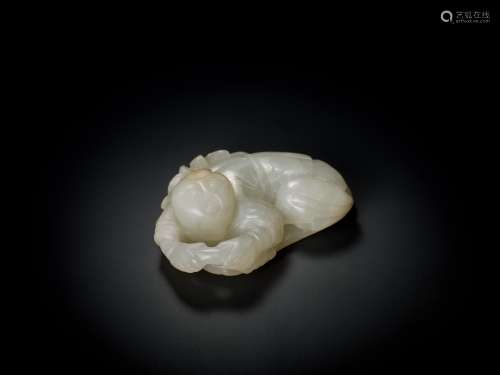 A WHITE JADE QING DYNASTY ‘BOY AND LOTUS’ PENDANT