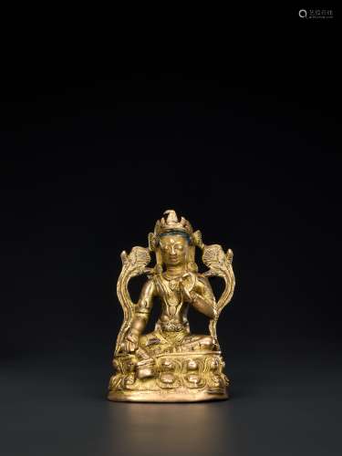 A 14TH CENTURY NEPALESE GILT BRONZE FIGURE OF TARA