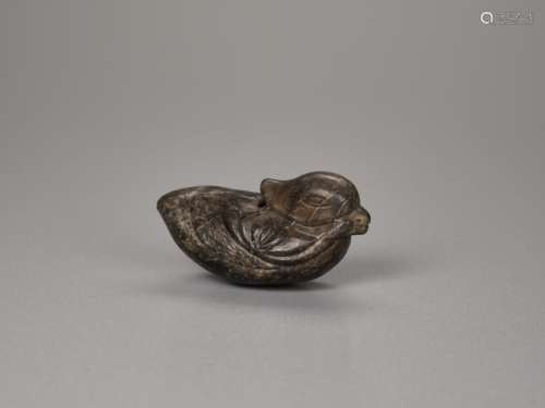 A YUAN / MING DYNASTY MOTTLED JADE TOGGLE OF A MANDARIN DUCK