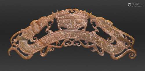 AN IMPRESSIVE ARCHED ORNAMENT DECORATED IN OPENWORK WITH DRAGONS AND A TAOTIE MASK