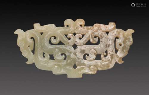 A BEAUTIFUL EASTERN ZHOU ORNAMENT WITH AN OPENWORK PATTERN OF DRAGONS