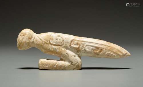 A LATE SHANG SCULPTURAL PRAYING MANTIS IN ALTERED JADE WITH AN IVORY QUALITY