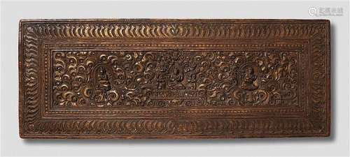 A Tibetan gilt wood manuscript cover. 17th/18th century