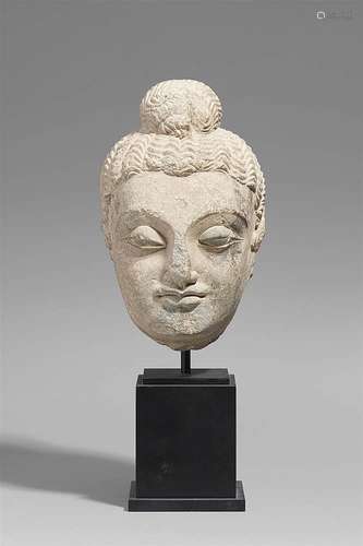 A large Gandhara grey schist head of a Buddha. Pakistan. 2nd/3rd century