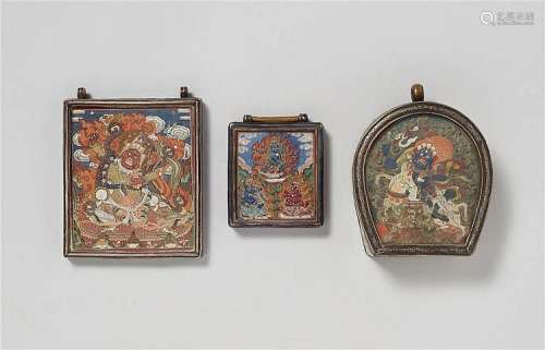 Three Mongolian silver and metal ga´u with tsagli. 19th/early 20th century