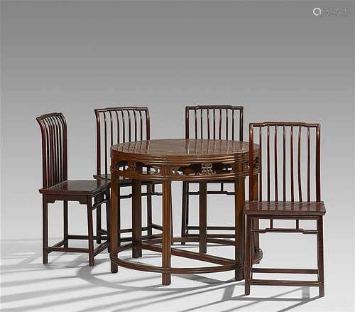 Two semicircular hardwood console tables, joined together, and four chairs. 19th/20th century