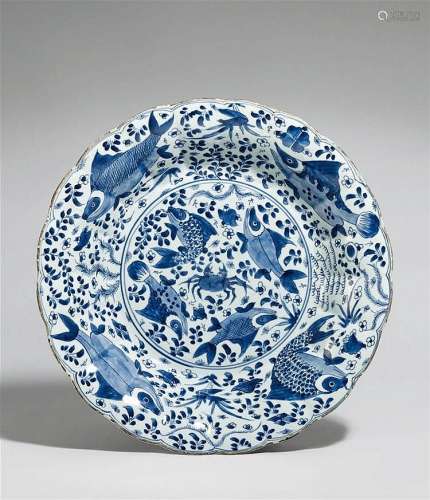 A blue and white moulded dish. Kangxi period (1662-1722)