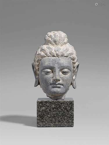 A Gandhara grey schist head of a Buddha. Pakistan. 2nd/3rd century