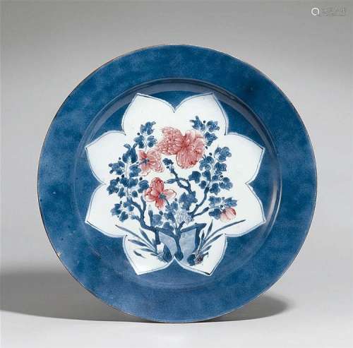 A powderblue-glazed dish with iron-red flowers. Kangxi period (1662-1722)