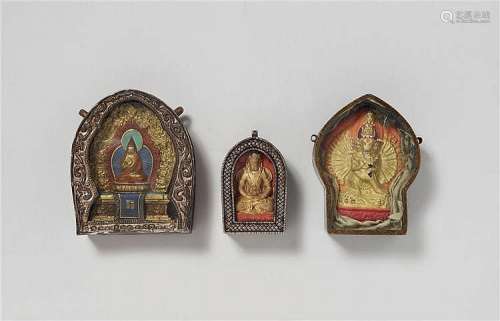 Three Mongolian silver and metal ga´u with tsatsa. 19th century