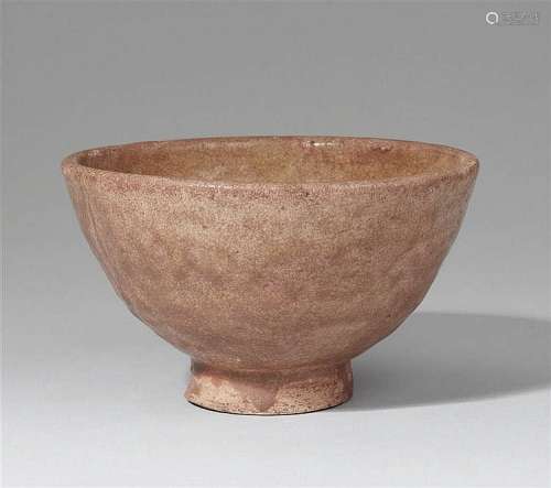 A greenish-brown glazed bowl of conical shape. Song dynasty (907-1279)