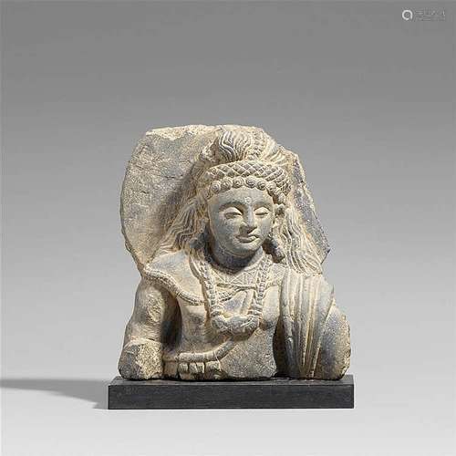 A Gandhara grey schist fragment of a Bodhisattva. Pakistan. 2nd/3rd century